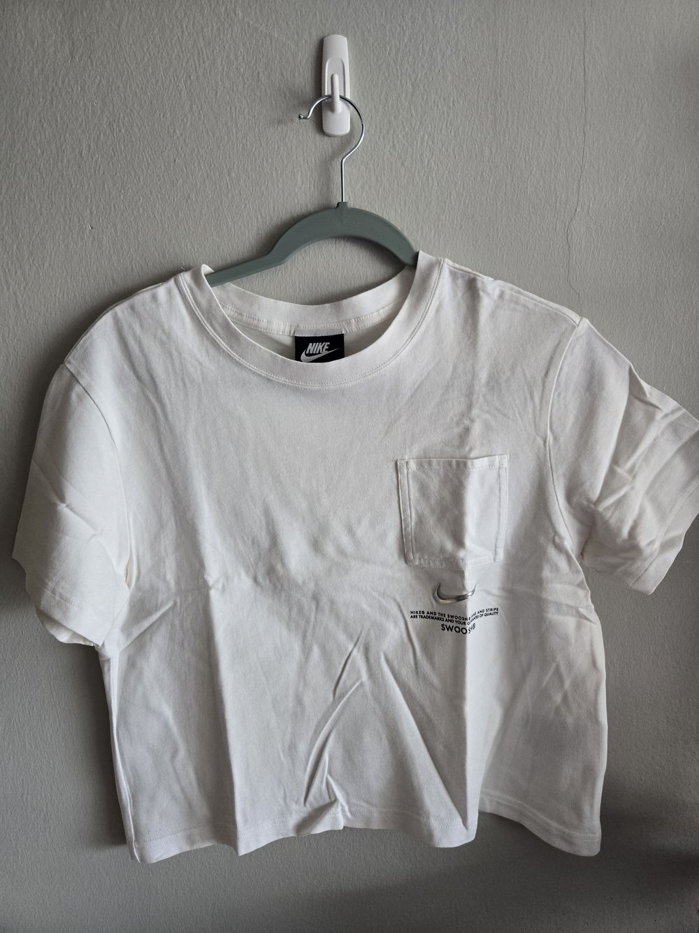 Nike White Cropped Pocket Tee with Small Black Swoosh